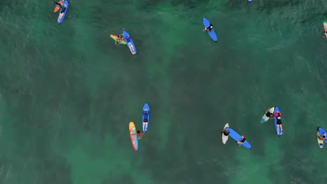 Tourists-floating-on-rented-surfboards-during-their-holiday