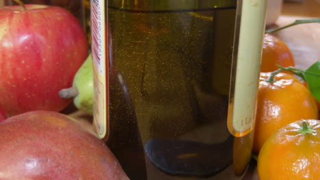 Close-up-of-olive-oil,-air-bubbles-rising-in-bottle