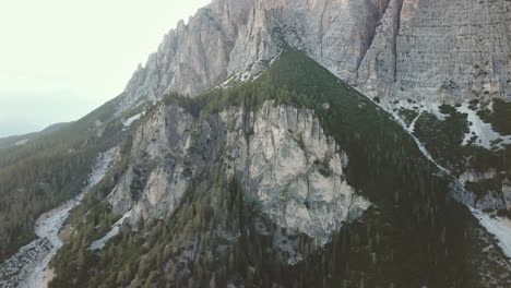 Crane-up-drone-shot-in-the-Alps-of-mountains-and-rocky-cliffs