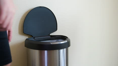 Man-Throws-Away-Paper-Towel-in-Motion-Sensing-Touchless-Trash-Can---Medium-Side