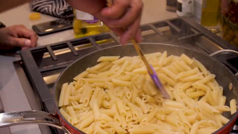 Pasta-being-cooked-in-a-pot