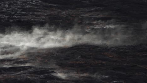 steam-from-volcano-rolls-off-hardened-magma-rock-for-a-dark-and-beautiful-feeling