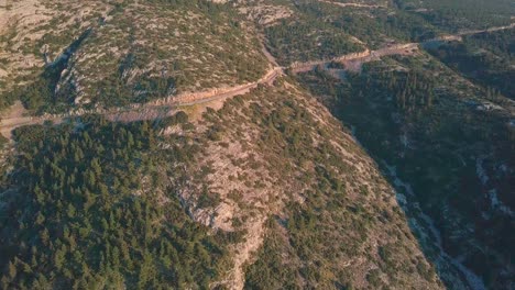 Panning-aerial-shot-of-Ymittos-mountain-next-to-Athens,-Greece-during-golden-hour-part-2