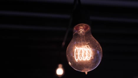 A-Lightbulb-hanging-in-the-dark