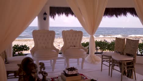 Chairs-overlooking-the-ocean-before-a-wedding-ceremony