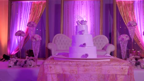 A-Wedding-Cake-under-colourful-lighting