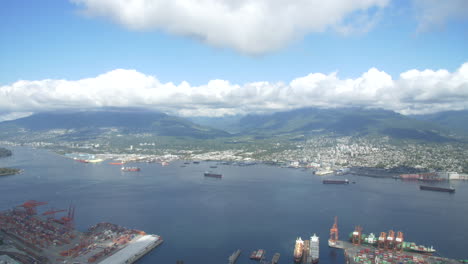 North-Vancouver-and-Lonsdale-ship-yards-from-Helicopter-looking-north-towards-the-second-narrows-bridge,-grouse-mountain-and-Seymour-Mountain-in-British-Columbia