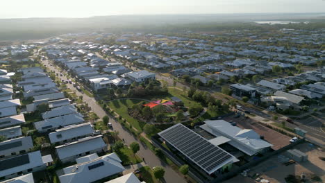 Aerial-drone-of-nature-parklands-and-children's-park-in-modern-suburb-neighbourhood