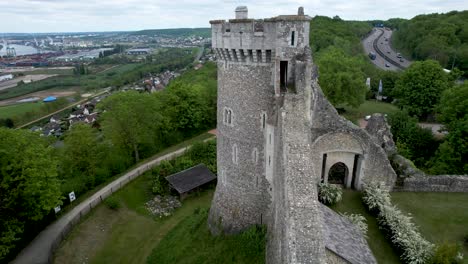 Aerial-view-of-castle-tower-in-Normandy-France-with-freeway-behind