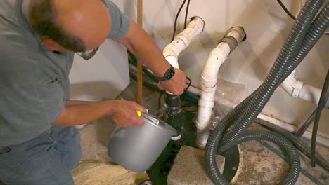 plumber-working-on-a-septic-sewer-in-a-house