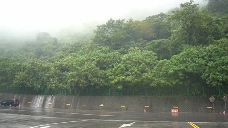 Panning-shot-of-dangerous-severe-weather-condition-with-heavy-rainfall-and-thick-fog-environment-caused-hazardous-driving-visibility-at-Hsuehshan-Tunnel-at-Hualien-City,-Taiwan