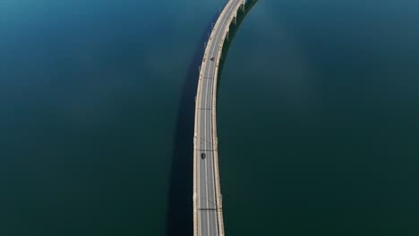 Techniti-Limni-Polifitou--Traffic-on-the-bridge-over-Polifitou-Lake-in-Greece
