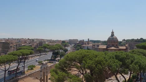 Distant-view-of-the-street-towards-the-Colosseum-in-Rome,-gladiatorial-arena-from-Roman-Empire