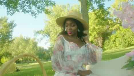 Black-Woman-enjoying-music-vibing-on-picnic-in-park-circling