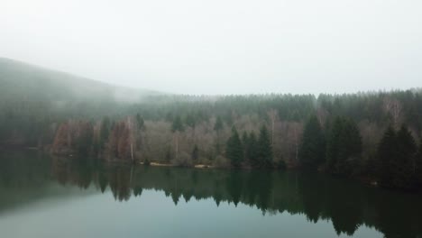 Aerial-view-of-a-lake-on-a-foggy-day