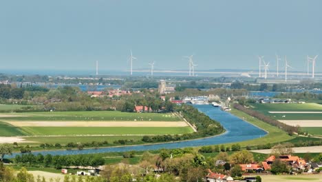Landscape-of-Veere,-Zeeland,-with-windmill-farm-in-distance