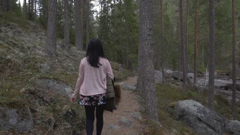 Girl-walking-in-the-forest
