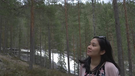 Girl-enjoying-the-view-in-the-forest