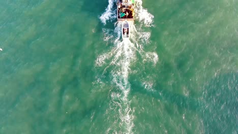 Top-view-of-a-fishing-boat-sailling-to-the-ocean