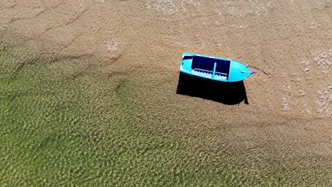 Boat-Alone-on-the-Shore-in-a-Low-Tide-in-Algarve