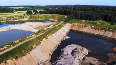 Aerial-shot-from-a-drone-of-artificial-pond-in-quarry-in-pomeranian-district-in-Poland