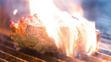 arge-steak-is-grilled,-there-is-smoke-from-the-coals-to-the-meat,-side-view,-close-up-shot-4ksteak-steak-with-a-very-tasty-view-4K