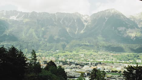 Scenic-view-of-the-City-Innsbruck,-Tyrol-with-alpine-mountains-with-parts-of-the-old-town-and-center