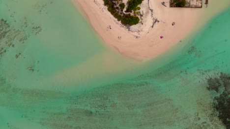 Drone-shot-of-small-island-in-Mauritius-with-beautiful-crystal-blue-water