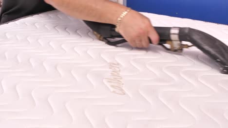 Chemical-cleaning-of-mattress-with-professional-vacuum-cleaner,-close-up