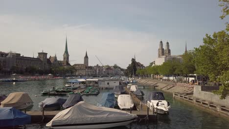 Zurich,-Switzerland---Jun-28,-2019:-boats-on-Lake-Zurich,-buildings-of-the-city-in-the-background