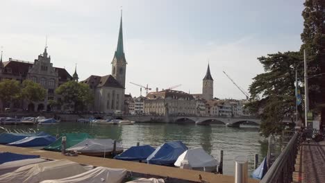 Zurich-downtown-skyline-with-Fraumunster-and-Grossmunster-churches-at-zurich-lake-at-night,-Switzerland