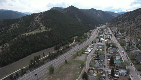 Aerial-View-of-Traffic-on-American-Interstate-I-70-Highway-by-Idaho-Springs,-Colorado-USA