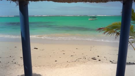 Palmar-beach-hut-by-the-crystal-blue-water