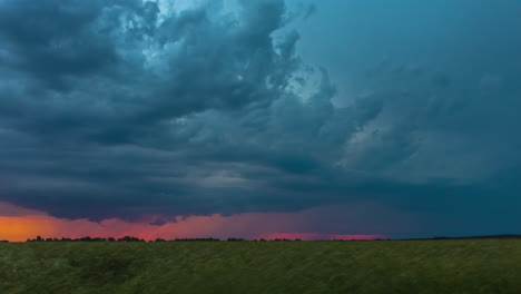Timelapse-of-dramatic-stormy-sky-at-dusk-over-meadow