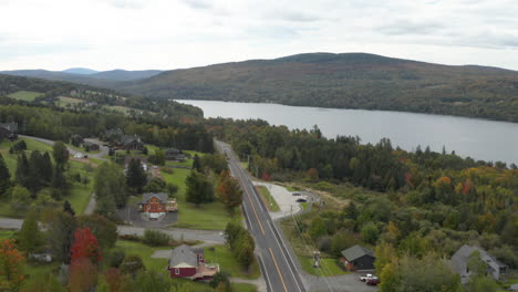 Gorgeous-drone-shot-looking-over-route-4-in-Rangeley-Maine
