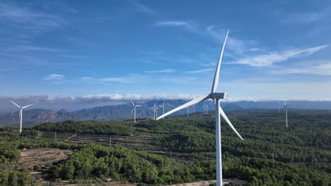 Majestic-aerial-drone-view-of-sustainable-wind-turbine-mill-energy,-dolly-left