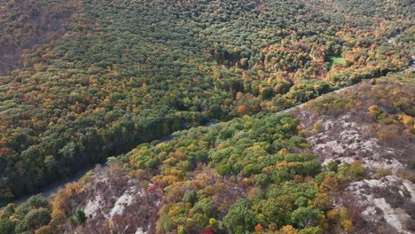 An-aerial-view-high-above-the-mountains-in-upstate-NY-in-the-fall-on-a-sunny-day