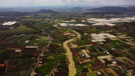Aerial-flying-forward-over-river-in-countryside-of-Southeastern-Vietnam