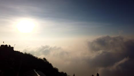 two-people-watching-early-morning-mist-cloud-evolution-timelapse,-Kodaikanal,-Tamil-Nadu,-India