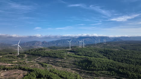 Windmills-aerial-view,-drone-flying-near-wind-turbine-blades,-static,-day