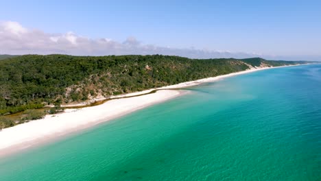 Slow-side-pan-drone-footage-from-the-remote-side-of-Fraser-Island-in-Queensland,-Australia