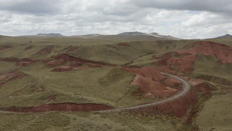Aerial-view-of-red-mountains-and-cloudy-sky-at-peruvian-highlands