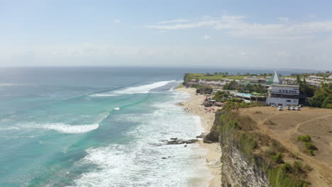 Steady-Drone-camera-filming-from-above-top-view-on-Bali-Dreamland-Beach-Hill-Resort