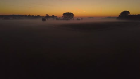 view-of-sunrise-over-misty-fields