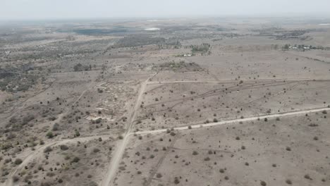 An-aerial-view,-shrubs-covering-a-desert-landscape