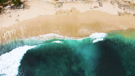 Turquoise-ocean-top-view-of-Bali-Indonesia-tropical-gold-sand-beach