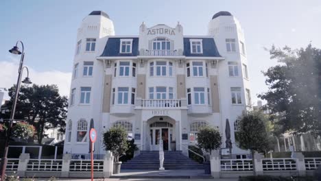 Facade-Of-Hotel-Astoria-Building-With-Belle-Epoque-Architecture-in-coastal-village-De-Haan,-Belgium