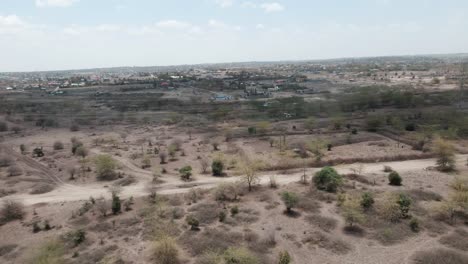 An-aerial-view-of-soil-and-shrubs-covering-a-desert-landscape