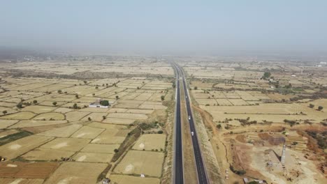 Aerial-Drone-shot-of-a-Highway-road-in-Central-India-,-Gwalior
