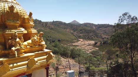 Golden-Hindu-Temple-in-Nilgiri-Biosphere-Reserve-outside-Ooty,-Tamil-Nadu,-India